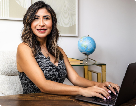 Jovana Vargas, Mortgage Loan Originator and real estate investor, working at her desk